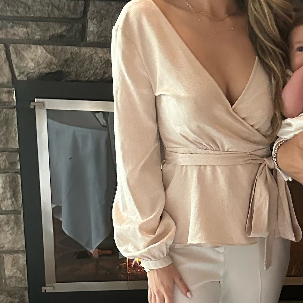 BCBG sleeveless cream top.
